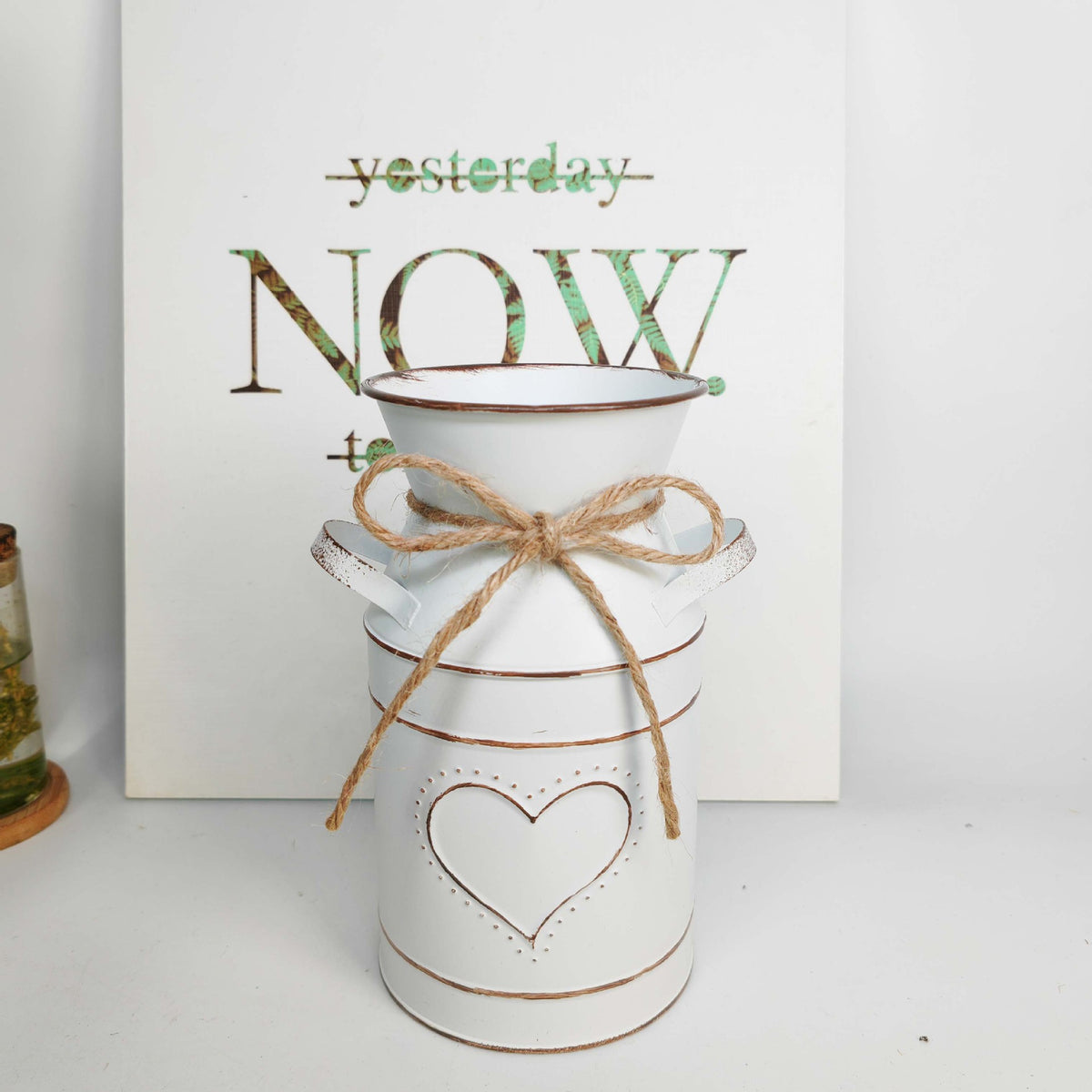 Distressed metal milk jug vase with jute rope wrap