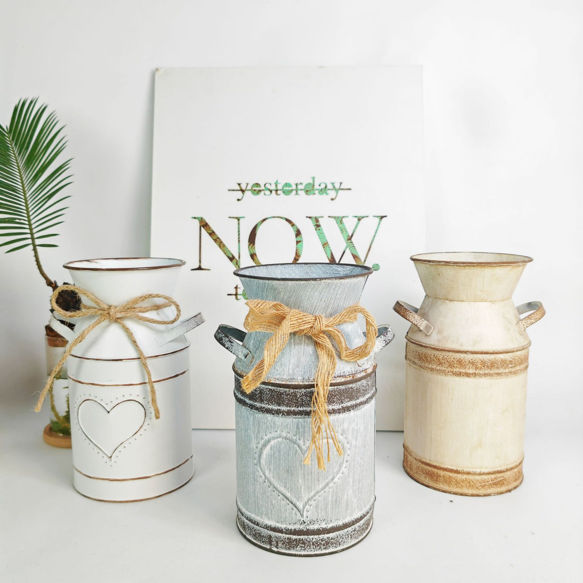 Distressed metal milk jug vase with jute rope wrap