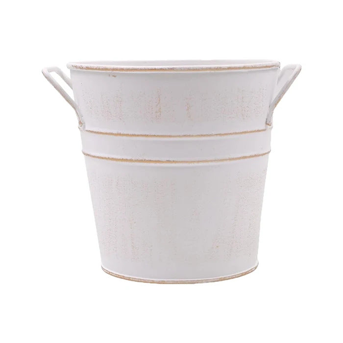 Small weathered iron flower bucket with handle